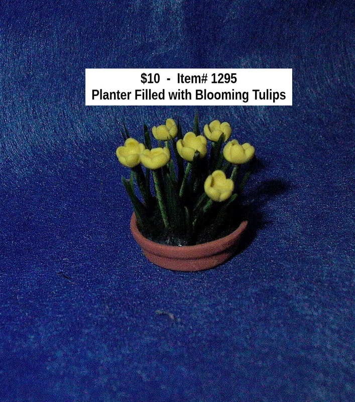 $10  -  Item# 1295 
Planter Filled with Blooming Tulips