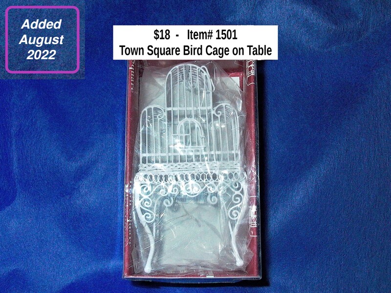 $18  -  Item# 1501 - Town Square Bird Cage On Table
 