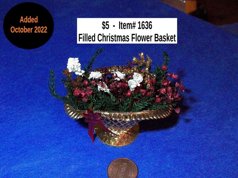 $5 - Item# 1636  -  Christmas Basket Filled with Flowers
