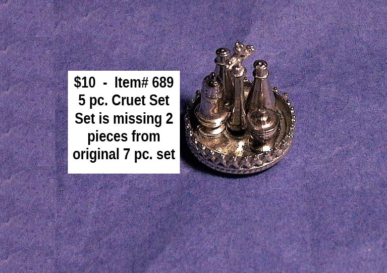 $10  -  Item# 689  - 
 5 Piece Cruet Set  
Note **Missing 2 pieces