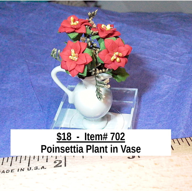 $18  -  Item# 702 -  
Poinsettia Plant in Vase