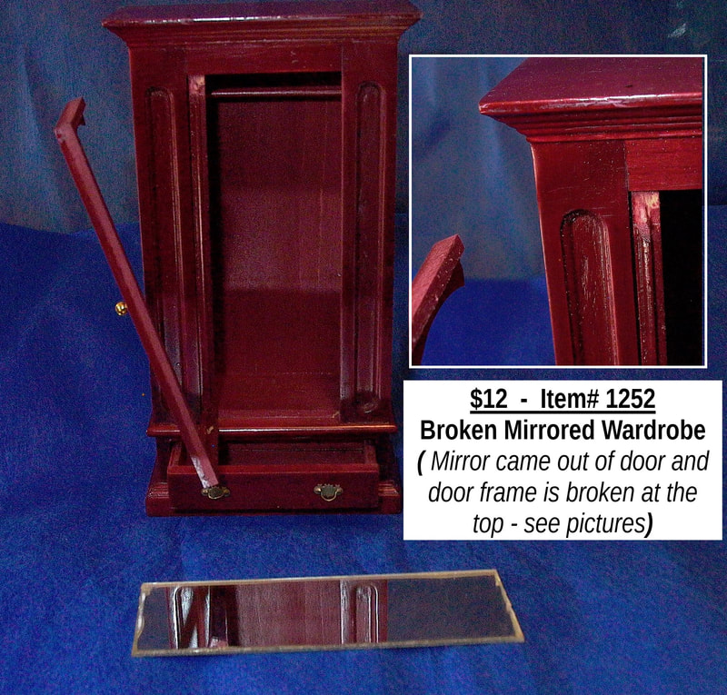 $12  -  Item# 1252 - 
Mirrored Wardrobe 
See pictures for broken door frame and loose mirror