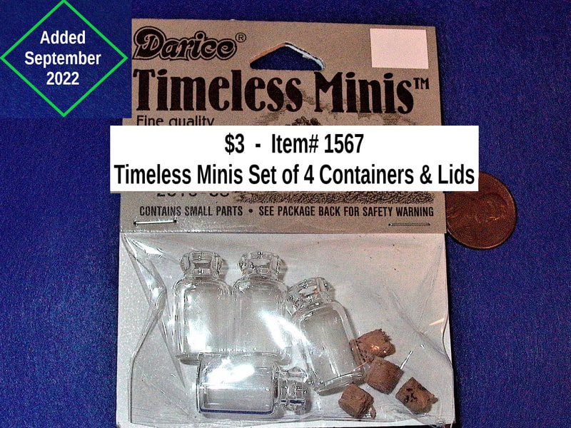 $3   -  Item# 1567 - 
Timeless Minis Set of 4 Glass Containers and Cork Lids (2 available)