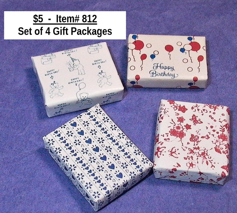$5 - Item# 812 -  
Set of 4 Gift Wrapped Packages